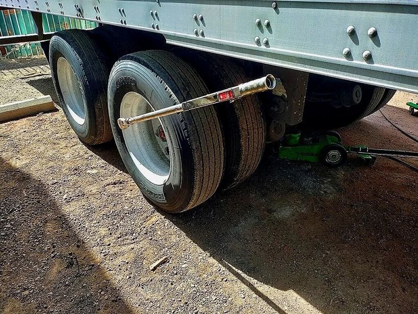Trailer dual wheels with a torque wrench on the lug nuts